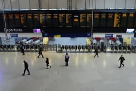 People pass through Waterloo Railway Station during a strike by members of the Associated Society of Locomotive Engineers and Firemen union (ASLEF) on January 30, 2024. (Photo by Carl Court/Getty Images)