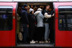 Commuters on a packed Central Line train. 