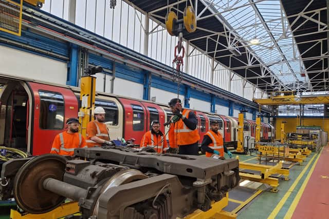TfL engineers replacing a motor on one of the Central line trains