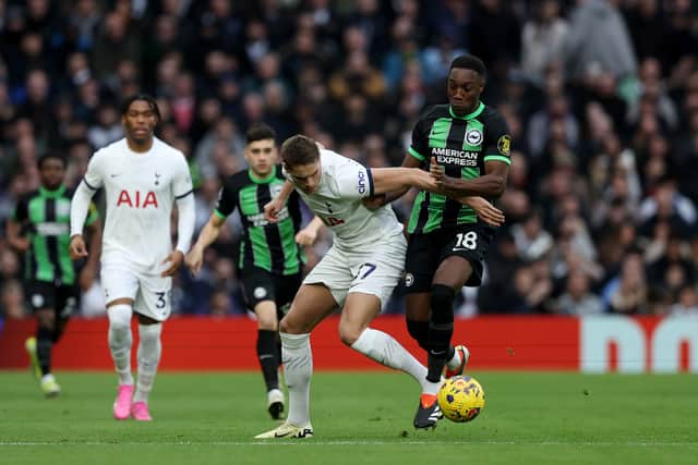 Micky van de Ven of Tottenham Hotspur is challenged by Danny Welbeck of Brighton & Hove Albion. (Photo by Richard Pelham/Getty Images)