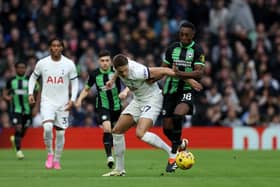 Micky van de Ven of Tottenham Hotspur is challenged by Danny Welbeck of Brighton & Hove Albion. (Photo by Richard Pelham/Getty Images)