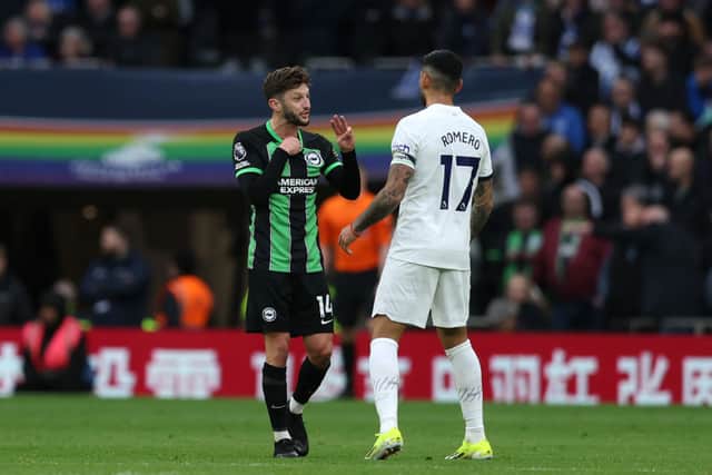 Adam Lallana and Cristian Romero. (Photo by Richard Pelham/Getty Images)