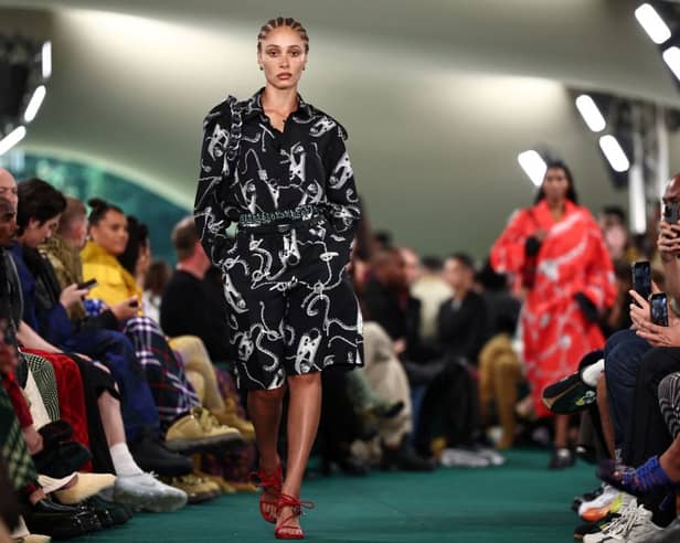 British model Adwoa Aboah presents a creation during a catwalk presentation for British fashion house Burberry's Spring/Summer 2024 collection, at London Fashion Week in London, on September 18, 2023. (Photo by HENRY NICHOLLS/AFP via Getty Images)