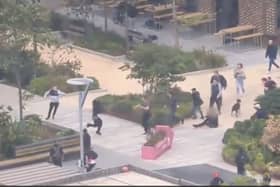 Off-duty Met Police officers tackle a man with a knife.