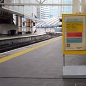 An "industrial action" sign on a London train platform.