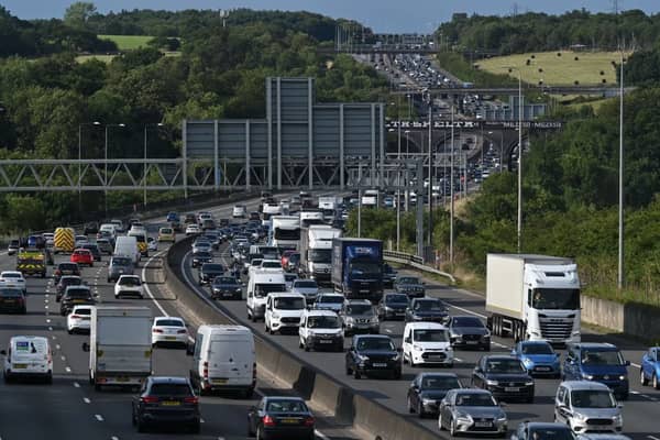 A Friday rush-hour traffic jam is pictured on the M25 London orbital motorway. (Photo by JUSTIN TALLIS / AFP via Getty Images)