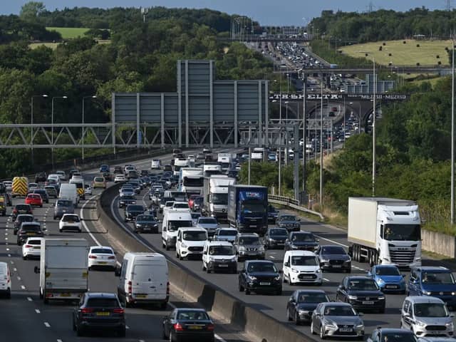 A Friday rush-hour traffic jam is pictured on the M25 London orbital motorway. (Photo by JUSTIN TALLIS / AFP via Getty Images)