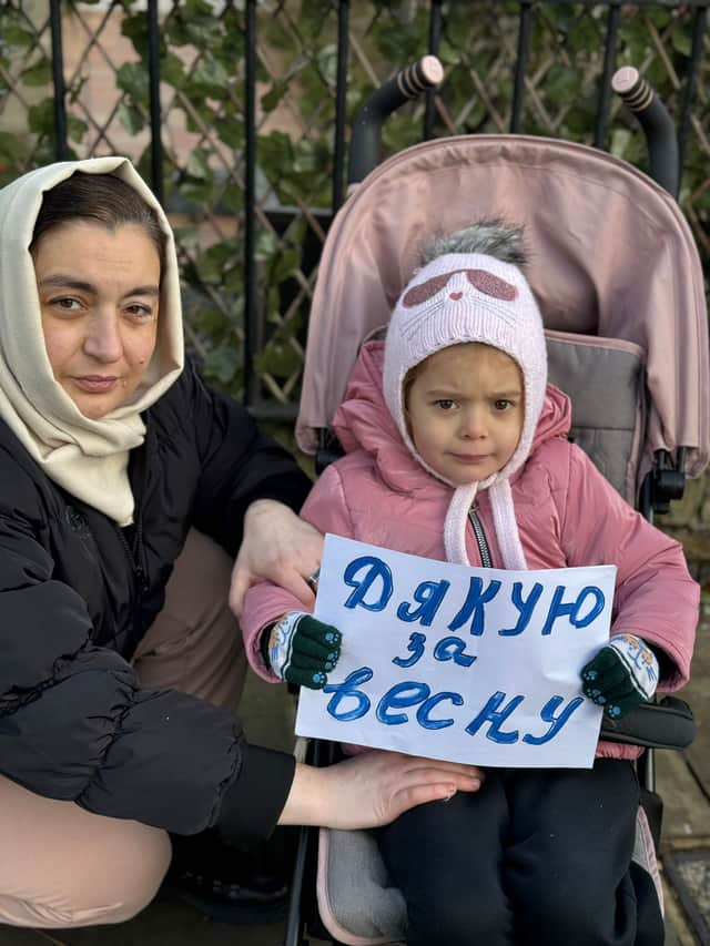 Natalia Ravliuk with her daughter at a protest