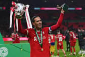 Liverpool defender Virgil van Dijk lifting the Carabao Cup