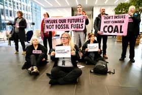 Extinction Rebellion protesters occupy the lobby of the Talbot building