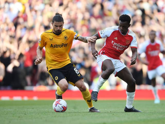 Eddie Nketiah and Ruben Neves in action during Wolves vs Arsenal