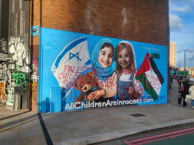 A new Israel-Palestine peace mural painted on a street in Shoreditch has been defaced 