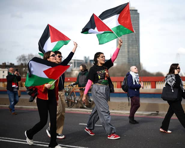 Pro-Palestinian activists and supporters march over Vauxhall Bridge