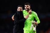Mikel Arteta (left) and Arsenal's Champions League hero David Raya