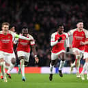 Arsenal stars celebrate their Last 16 win over Porto following 4-2 penalty shoot-out win.