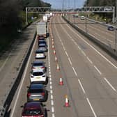 Vehicles are seen queuing to leave the carriageway at Junction 10 of the London orbital motorway the M25.