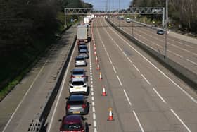 Vehicles are seen queuing to leave the carriageway at Junction 10 of the London orbital motorway the M25.