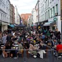 People socialising in Soho after lockdown restrictions eased in April 2021. 