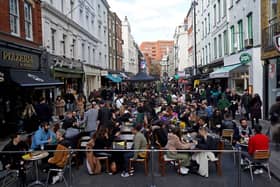 People socialising in Soho after lockdown restrictions eased in April 2021. 