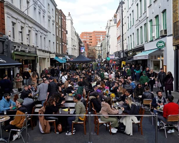 People socialising in Soho after lockdown restrictions eased in April 2021. 