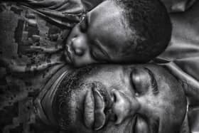 Photographer: "While I slept, my little boy came to lie beside me and slept off. He had awakened me when he came in, and typically I couldn't get back to my nap. But my eyes were still heavy, and my phone was near me. I had an idea. I took the shot in the position we slept off in. I made me think how he came from me, and still was, as it looks in the image, very much attached to me and will always have my heart. This remains one of my all-time favourite images."