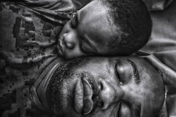 Photographer: "While I slept, my little boy came to lie beside me and slept off. He had awakened me when he came in, and typically I couldn't get back to my nap. But my eyes were still heavy, and my phone was near me. I had an idea. I took the shot in the position we slept off in. I made me think how he came from me, and still was, as it looks in the image, very much attached to me and will always have my heart. This remains one of my all-time favourite images."