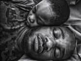 Photographer: "While I slept, my little boy came to lie beside me and slept off. He had awakened me when he came in, and typically I couldn't get back to my nap. But my eyes were still heavy, and my phone was near me. I had an idea. I took the shot in the position we slept off in. I made me think how he came from me, and still was, as it looks in the image, very much attached to me and will always have my heart. This remains one of my all-time favourite images."