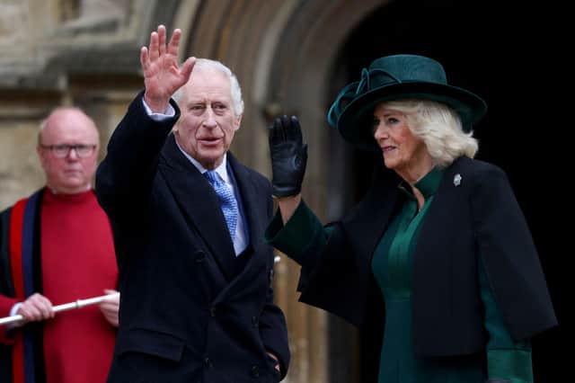 King Charles III and Queen Camilla waves as they arrive at St George's Chapel, Windsor Castle, to attend the Easter Mattins Service, on March 31, 2024.