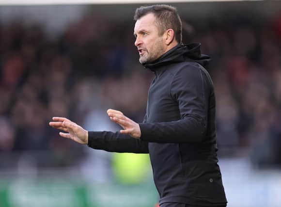 Nathan Jones looks to continue an unbeaten run against Wigan Athletic.