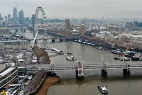 An aerial view shows snow-covered offices and buildings in central London.
