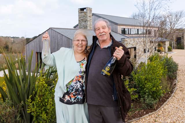 Omaze Million Pound House Draw Cornwall winner Rose Doyle with husband Tony outside their new home.