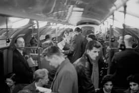 Commuters on a train travelling from Tottenham Court Road to Morden in London.
