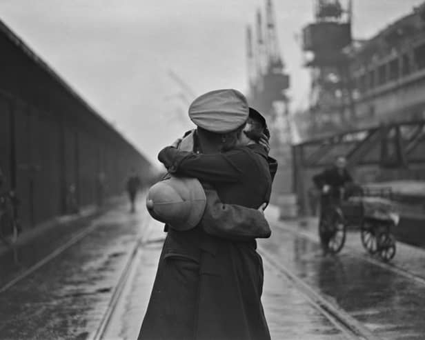 December 4 1934:  A soldier kissing his wife at King George V's dock, London, after returning from being stationed in India.  (Photo by Douglas Miller/Topical Press Agency/Hulton Archive/Getty Images)