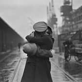 December 4 1934:  A soldier kissing his wife at King George V's dock, London, after returning from being stationed in India.  (Photo by Douglas Miller/Topical Press Agency/Hulton Archive/Getty Images)