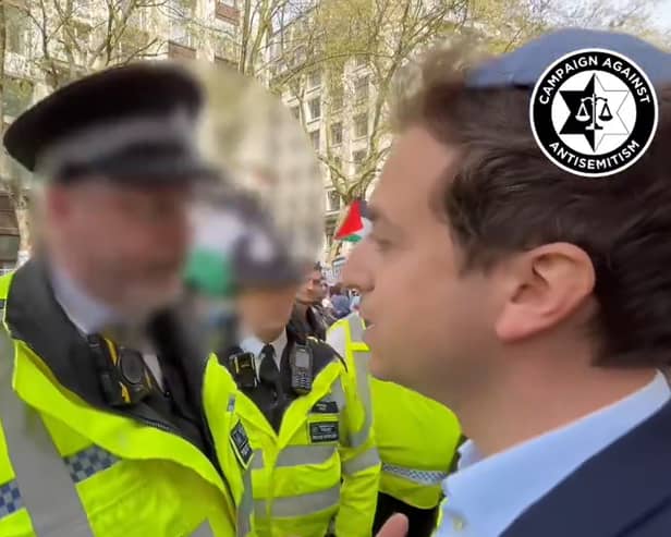 Video footage shows a Met Police officer in an exchange with  Gideon Falter, chief executive of the Campaign Against Antisemitism, next to a pro-Palestinian march.