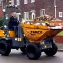 Dave Newton's funeral with his coffin in a dumper truck. 