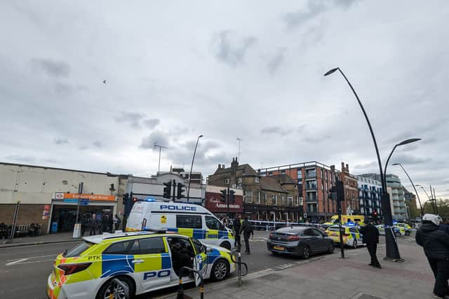 A large police cordon was set up outside Kilburn High Road Overground station