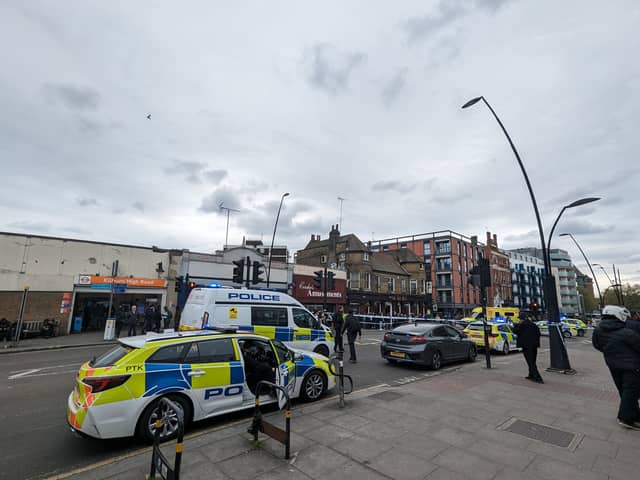A large police cordon was set up outside Kilburn High Road Overground station