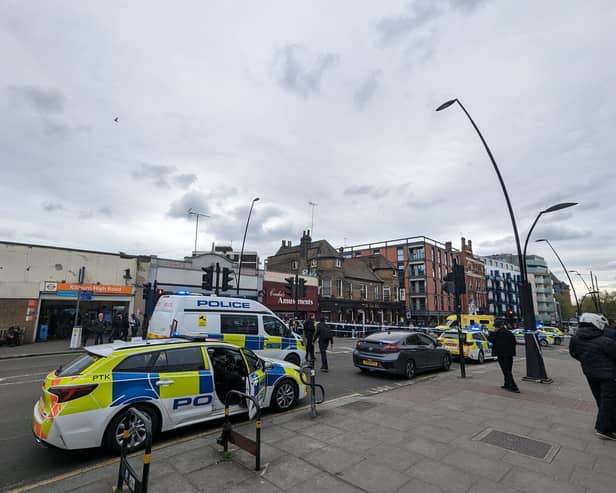 A large police cordon was set up outside Kilburn High Road Overground station