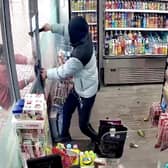 CCTV of an armed robbery where the burglars yielded a machete. 