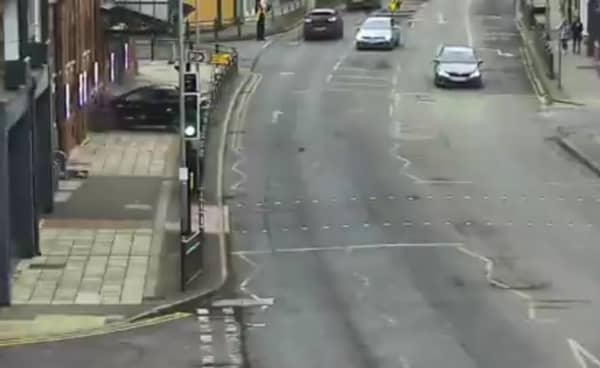 Car crashes through metal barriers and into the front of theatre.