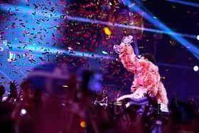 MALMO, SWEDEN - MAY 11: Nemo from Switzerland, winner of the Eurovision Song Contest, raises the trophy on stage after The Eurovision Song Contest 2024 Grand Final at Malmo Arena on May 11, 2024 in Malmo, Sweden. (Photo by Martin Sylvest Andersen/Getty Images)