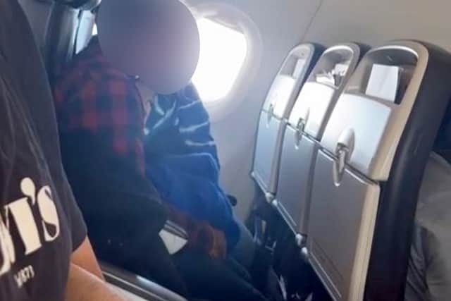 Video grab appearing to capture a woman pleasuring a male on a flight from London Heathrow to Dublin, May 7, 2024.  