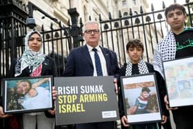 Wafaa Shamallakh (left), Brendan O'Hara MP, and her two sons