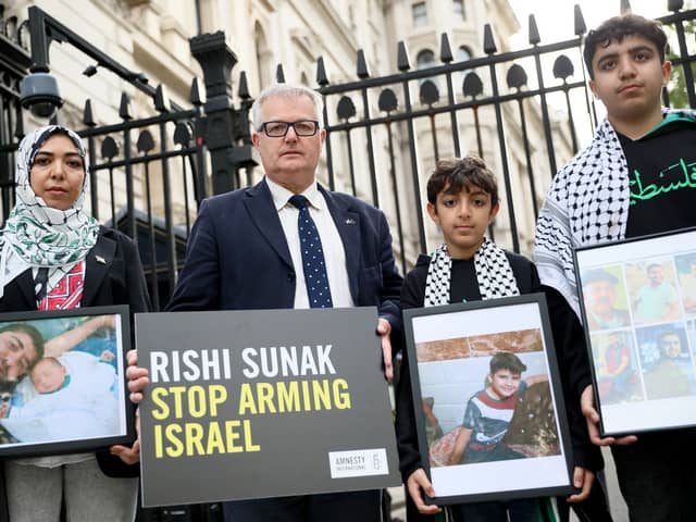 Wafaa Shamallakh (left), Brendan O'Hara MP, and her two sons