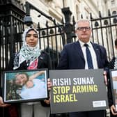 Wafaa Shamallakh (left), Brendan O'Hara MP, and her two sons