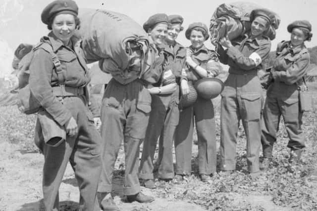A party of Sisters of Queen Alexandra's Imperial Military Nursing Service pose for a photograph at La Delivrande, Normandy, 1944.