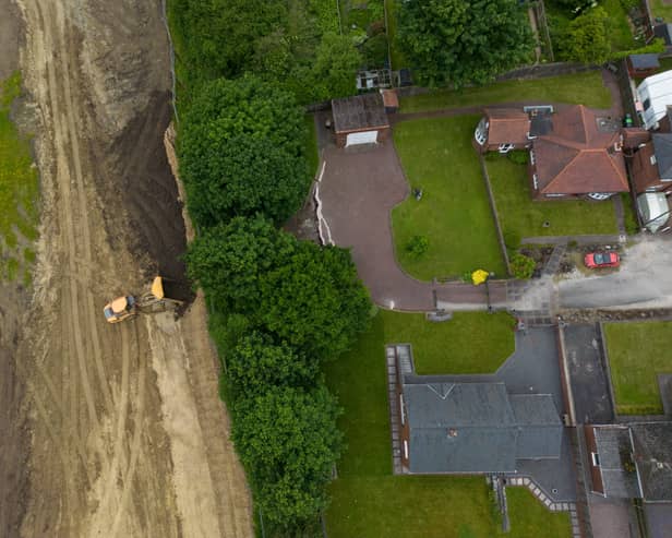 Cracks appear in driveways after start of nearby building work.