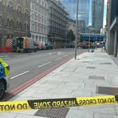 A cordon and road closure is in place on Southwark Street