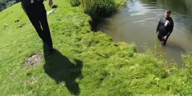 Fynley Jefferies emerges from river after jumping in to escape police.